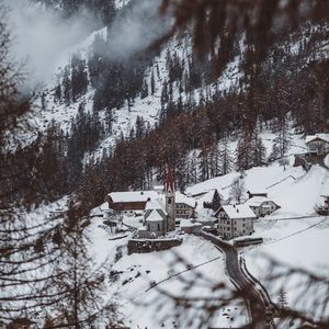 Preview wallpaper mountain, buildings, snow, trees, slope, aerial view