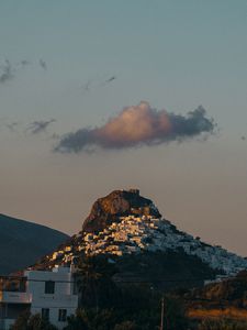 Preview wallpaper mountain, city, buildings, sky, cloud