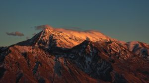 Preview wallpaper mountain, clouds, snow, dusk, landscape