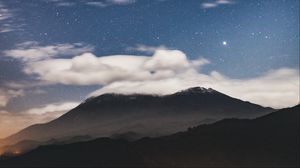 Preview wallpaper mountain, clouds, stars, dusk, long exposure