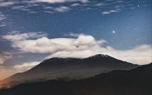 Preview wallpaper mountain, clouds, stars, dusk, long exposure