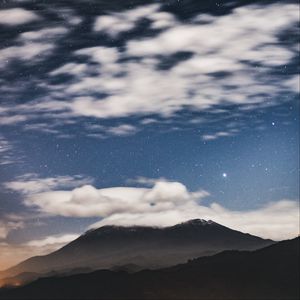 Preview wallpaper mountain, clouds, stars, dusk, long exposure