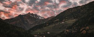 Preview wallpaper mountain, clouds, village, forest, trees, sunset