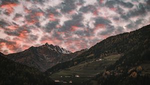 Preview wallpaper mountain, clouds, village, forest, trees, sunset