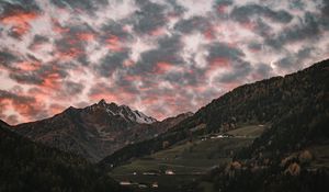 Preview wallpaper mountain, clouds, village, forest, trees, sunset
