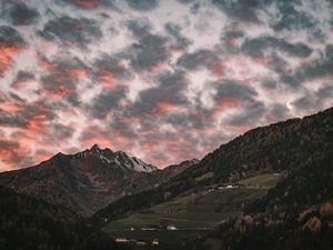 Preview wallpaper mountain, clouds, village, forest, trees, sunset