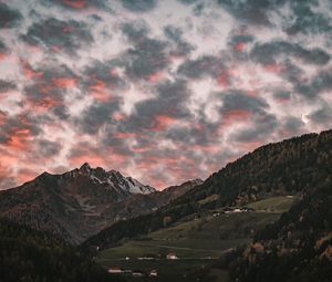 Preview wallpaper mountain, clouds, village, forest, trees, sunset