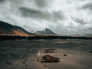 Preview wallpaper mountain, coast, sand, footprints, landscape