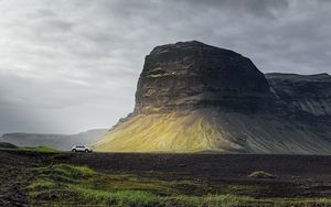 Preview wallpaper mountain, field, car, clouds