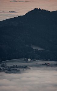 Preview wallpaper mountain, forest, fog, clouds, buildings, aerial view