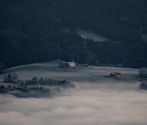 Preview wallpaper mountain, forest, fog, clouds, buildings, aerial view