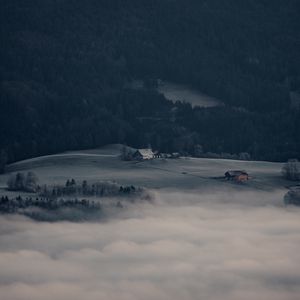 Preview wallpaper mountain, forest, fog, clouds, buildings, aerial view