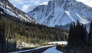 Preview wallpaper mountain, forest, road, snow, winter