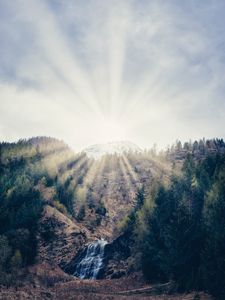 Preview wallpaper mountain, forest, sunlight, bright, slope, waterfall