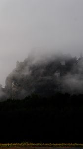 Preview wallpaper mountain, fortress, fog, forest, nature