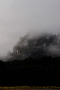 Preview wallpaper mountain, fortress, fog, forest, nature