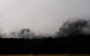Preview wallpaper mountain, fortress, fog, forest, nature