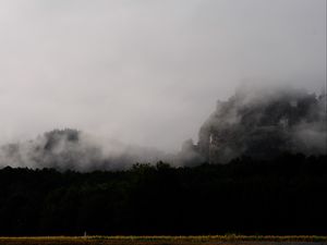 Preview wallpaper mountain, fortress, fog, forest, nature