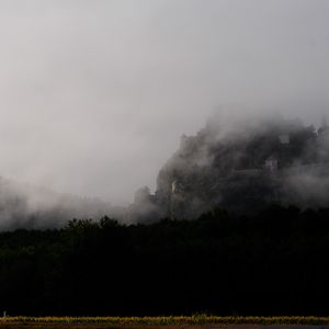 Preview wallpaper mountain, fortress, fog, forest, nature