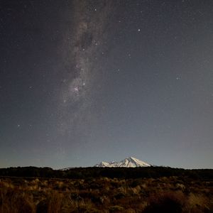 Preview wallpaper mountain, grass, milky way, night