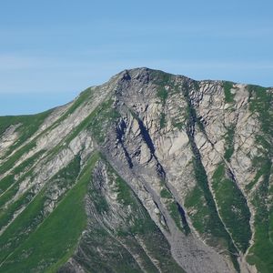 Preview wallpaper mountain, grass, rock, relief, slope