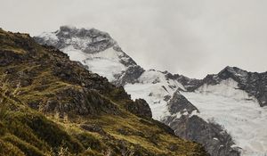 Preview wallpaper mountain, grass, snow, hill