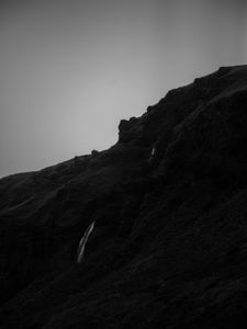 Preview wallpaper mountain, grass, waterfall, black and white