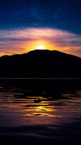 Preview wallpaper mountain, hill, silhouette, sea, sunset, dark