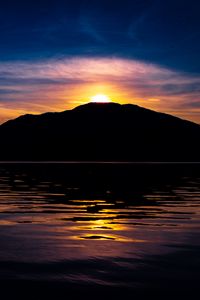 Preview wallpaper mountain, hill, silhouette, sea, sunset, dark