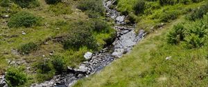 Preview wallpaper mountain, hill, stream, stones, grass, nature