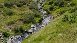 Preview wallpaper mountain, hill, stream, stones, grass, nature