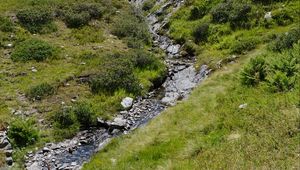 Preview wallpaper mountain, hill, stream, stones, grass, nature