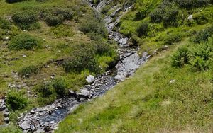 Preview wallpaper mountain, hill, stream, stones, grass, nature