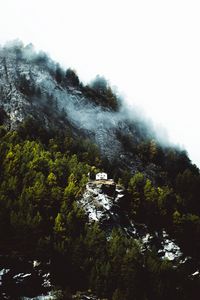 Preview wallpaper mountain, house, slope, rock, trees