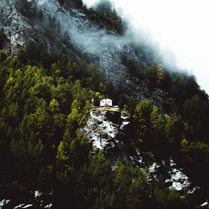 Preview wallpaper mountain, house, slope, rock, trees