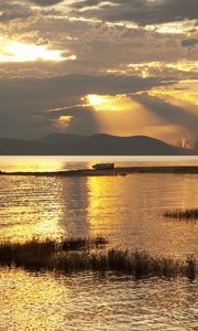 Preview wallpaper mountain, lake, boat, sunset, gold