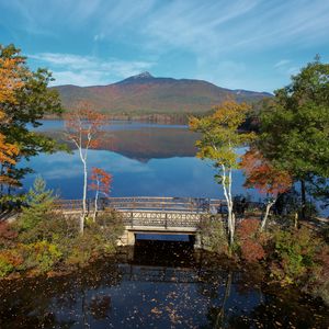 Preview wallpaper mountain, lake, bridge, trees, autumn, landscape