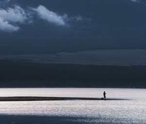 Preview wallpaper mountain, lake, fisherman, silhouette