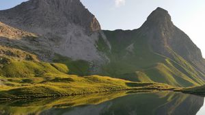 Preview wallpaper mountain, lake, grass, reflection