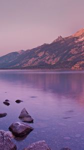 Preview wallpaper mountain, lake, reflection, stones, coast, sky, gray