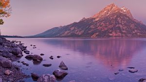 Preview wallpaper mountain, lake, reflection, stones, coast, sky, gray