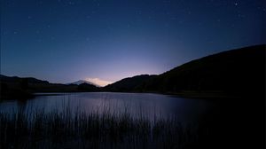 Preview wallpaper mountain, lake, starry sky, stars, grass