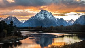 Preview wallpaper mountain, lake, sunset, sky, clouds, peak, landscape