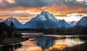 Preview wallpaper mountain, lake, sunset, sky, clouds, peak, landscape
