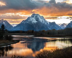 Preview wallpaper mountain, lake, sunset, sky, clouds, peak, landscape