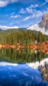Preview wallpaper mountain, lakes, lodges, coast, wood, coniferous, colors, paints, reflection, bottom, sky, landscape
