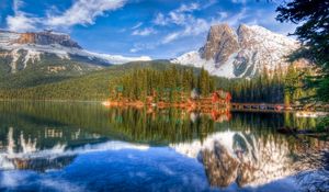 Preview wallpaper mountain, lakes, lodges, coast, wood, coniferous, colors, paints, reflection, bottom, sky, landscape