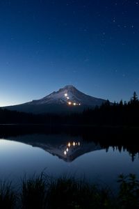 Preview wallpaper mountain, lights, lake, reflection, trees, night