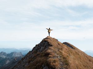 Preview wallpaper mountain, man, alone, peak, freedom