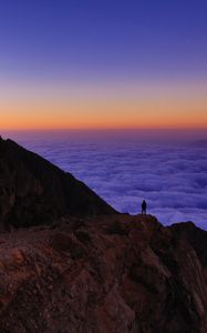 Preview wallpaper mountain, man, loneliness, clouds, al bahah, saudi arabia